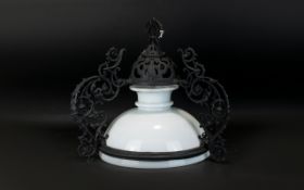 A Traditional Dutch Ceiling Lamp Antique glass lamp with cast metal filigree arms and pulley chain