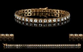 Antique Gold Diamond Tennis Bracelet set with 36 old round cut diamonds. Length 7 inches. Est