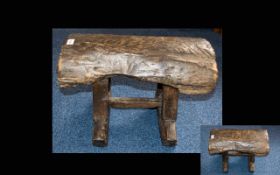 A Hand Made Rustic Style Stool low stool with bottom stretcher seat formed from stained weathered