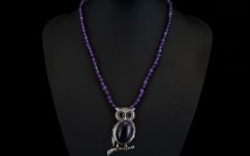 Amethyst 'Owl' Pendant Necklace, a 35ct cabochon cut amethyst forming the body of the owl pendant