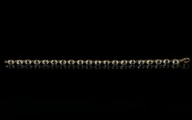 White Topaz And Gold Plate Contemporary Tennis Bracelet The whole in silver, finished with gold