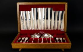 A Large Boxed Canteen Of Cutlery Stainless cutlery set in original fitted box with red velvet