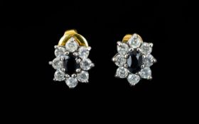 Ladies - Nice Quality Flower Head Design Earrings Dark faceted central stone, surrounded by CZ. Good