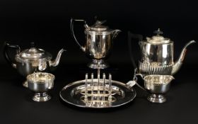 A Plated Metal Matched Tea And Coffee Service Of typical form, to include teapot, coffee pot,