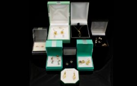A Collection Of 9ct Gold Jewellery Comprising pendant and chain, bauble earrings, leaf earrings,