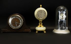 Three Mantle Clocks To include chrome anniversary clock, onyx clock and an oak cased clock.
