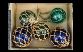 A Collection of 5 Victorian Glass Fishing Floats in Greens and Blues.