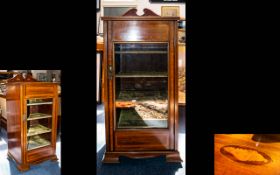 An Edwardian Display Cabinet. Raised on