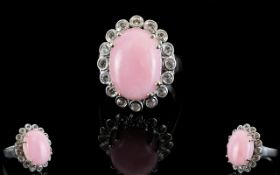 Pink Opal and White Topaz Halo Ring, a 9