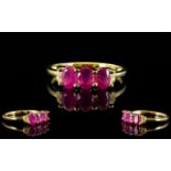 Ruby and White Topaz Ring, a trio of ova