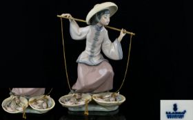 Lladro Porcelain Figurine ' Fish a Plenty ' Model 5172. Issued 1982 - 1994. Height 9 Inches - 22.