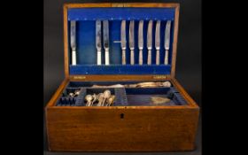 A Mixed Canteen of Cutlery housed in early 20thC Fitted Box brass handles to sides,