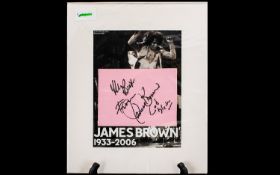 James Brown Autograph on a page displayed with with picture of the ''Godfather of Soul''.