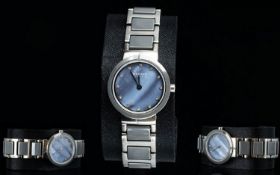 Bering - Ladies Steel and Ceramic Watch. Features Purple and Green Tones For The Mother of Pearl