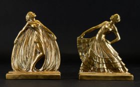 A Pair Of Art Deco Style Brass Bookends Figural bookends in the form of two opulently attired