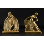 A Pair Of Art Deco Style Brass Bookends Figural bookends in the form of two opulently attired