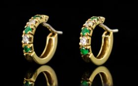 Ladies 18ct Gold Pair of Elegant Emerald and Diamond Earrings In a Hoop Design.