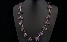 A Vintage Amethyst Necklace Long pewter tone necklace set with multiple, organic form polished