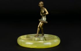 1950's Ashtray consisting of a green onyx base with a figural spelter dancer. 4 inches in height.