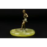 1950's Ashtray consisting of a green onyx base with a figural spelter dancer. 4 inches in height.