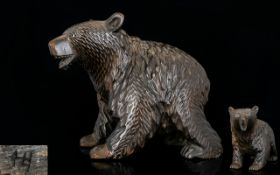 A Black Forest Carved Wood Bear with Bead Eyes. 7 Inches long x 6.5 Inches High.