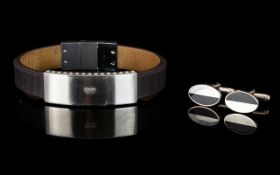 Emporio Armani Stainless Steel And Leather Bracelet Contemporary wide bracelet with stainless clasp