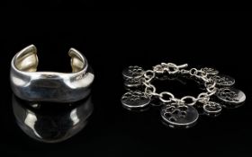 Contemporary Designed Sterling Silver Link Bracelet with attached open work circle shaped earrings.