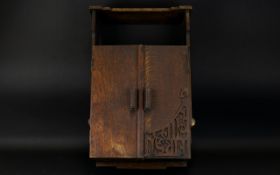 Antique Oak Wall Mounted Cabinet. rustic Arts & Crafts style with double doors and fretwork detail