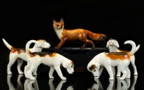 Four Beswick Foxhounds Model No's 2263, 2264, 2662 and 2265. Designer Graham Tongue.
