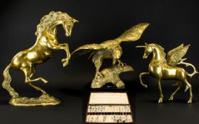 A Collection Of Brass Ornaments Comprising bird of prey, unicorn and prancing horse.