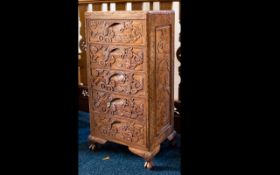 An Indonesian Carved Chest Of Drawers five drawer unit with oriental carving, height 32 inches,