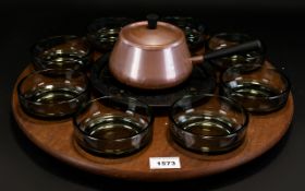 A 1970's Rotating Fondue Set Comprising circular rotating wooden tray complete with original melting