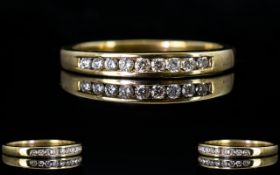 Ladies 9ct Yellow Gold Channel Set Diamond Ring, The Nine Round Diamonds of Good Colour and Clarity.