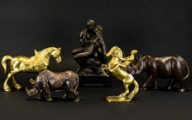 A Collection Of Metalware Figures Comprising horse and rider, resin Rhino, carved wood Rhino,