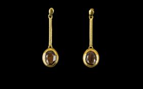 Golden Lustre Sapphire Drop Earrings, 5cts over two oval cut solitaires of the natural golden lustre