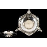 Arts And Crafts Silver Footed Bowl Planished form with three pierced handles.