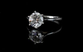 A Silver And Simulated Diamond Dress Ring Ladies solitaire ring with reticulated shoulder detail.