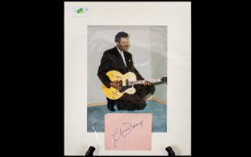 Chuck Berry Autograph on 1960s page displayed with photograph of singer.