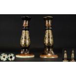 A Pair of Oriental Candlesticks two earthenware candlesticks of pillar form,