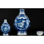 Chinese Blue And White Moon Flask Decorated with pagoda's and landscape scenes,