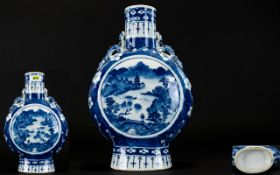 Chinese Blue And White Moon Flask Decorated with pagoda's and landscape scenes,