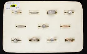 A Collection Of Contemporary Sterling Silver And CZ Set Rings Eleven in total to include large