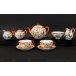 Japanese Part Tea Service Comprising teapot, two cups and accompanying saucers,