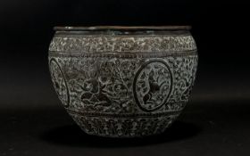 A 19th Century Middle Eastern Brass Jardiniere with embossed decoration depicting deity's and