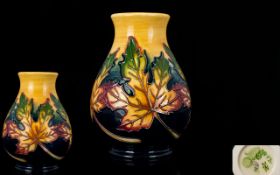 Moorcroft Modern Tube lined Vase ' Autumn Maple Leaves ' Design. Designer Emma Bossons. Date 2012.