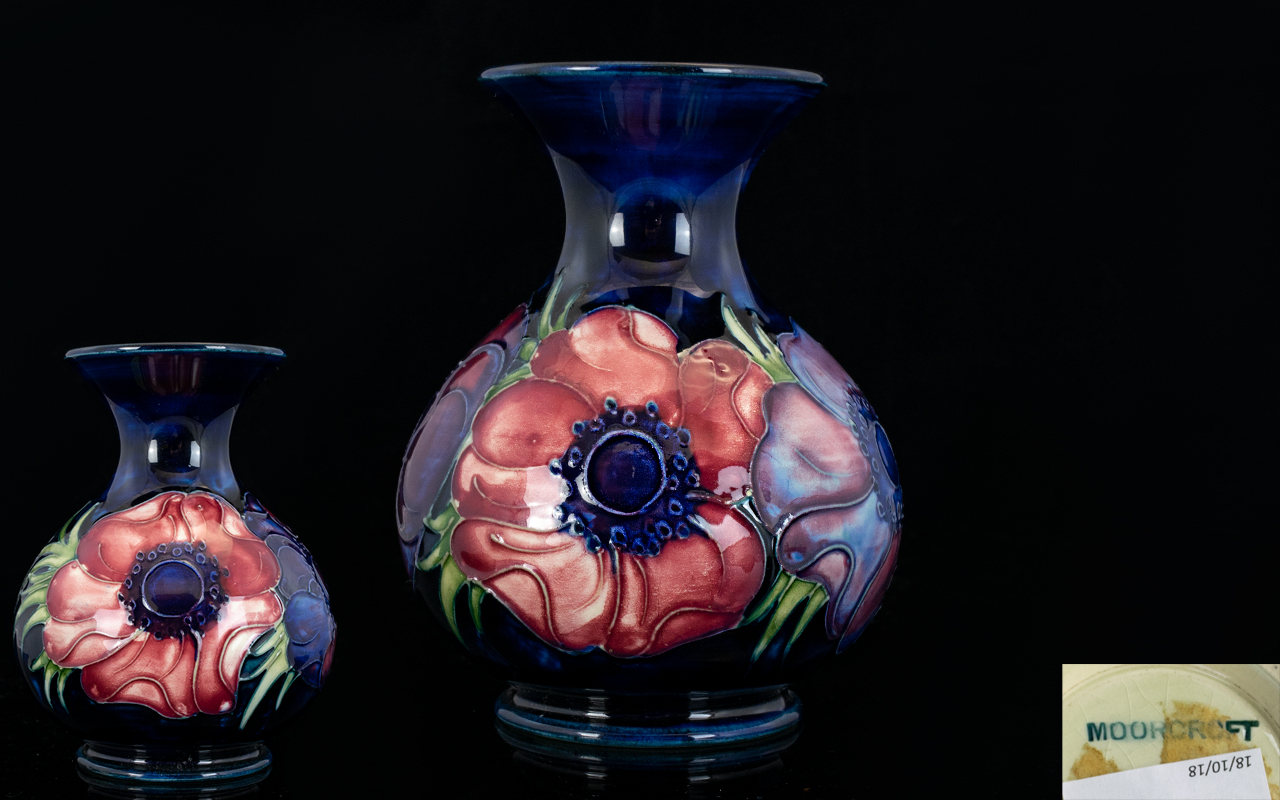 Moorcroft Bulbous Shaped Tube lined Small Vase ' Anemone ' Design on Blue Ground. c.1975.