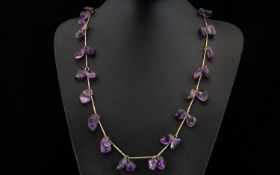 A Vintage Amethyst Necklace Long pewter tone necklace set with multiple,