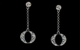 Diamond Pair of Oval Drop Earrings, open ovoid drops, set with baguette cut diamonds,