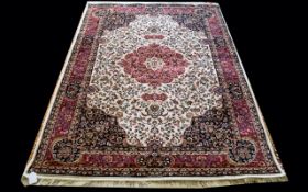 A Large Woven Silk Carpet Keshan rug with beige ground and traditional Middle Eastern floral and