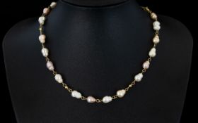 Fresh Water Pearl Necklace Silver gilt chain and clasp, length 16 inches.